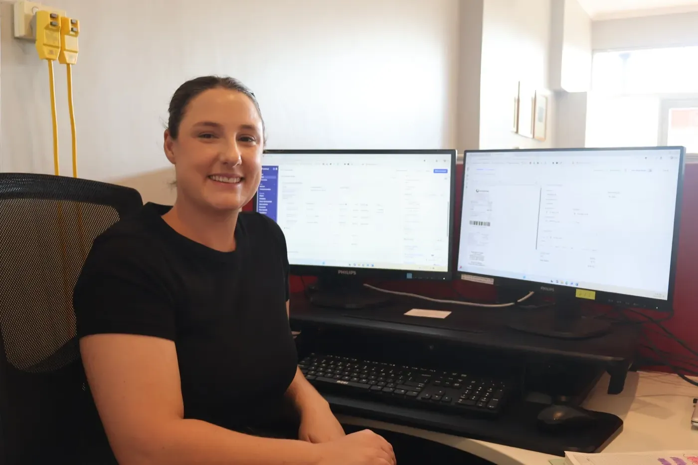 Gemma at her desk at Home Care Assistance Newcastle